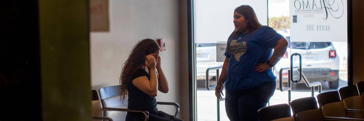 Patient cries at an abortion clinic post Dobbs decision.