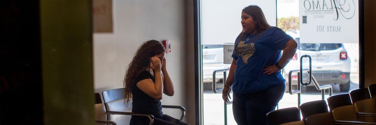 Patient cries at an abortion clinic post Dobbs decision.