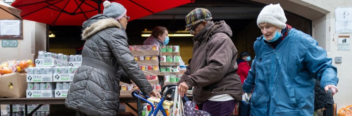People accept free food at food bank in Brooklyn