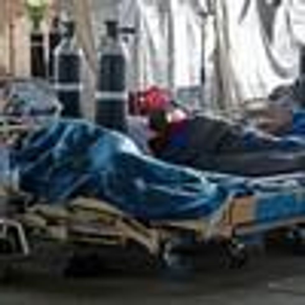 People are seen lying on hospital beds inside a temporary ward dedicated to the treatment of Covid-19 patients at Steve Biko Academic Hospital in Pretoria, South Africa on January 11, 2021. (Photo: Phill Magakoe/AFP via Getty Images)