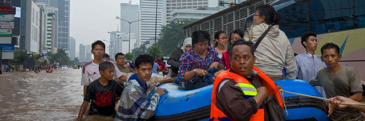 People are stranded by floodwaters in Jakarta's central business district on January 17, 2013 in Jakarta, Indonesia.