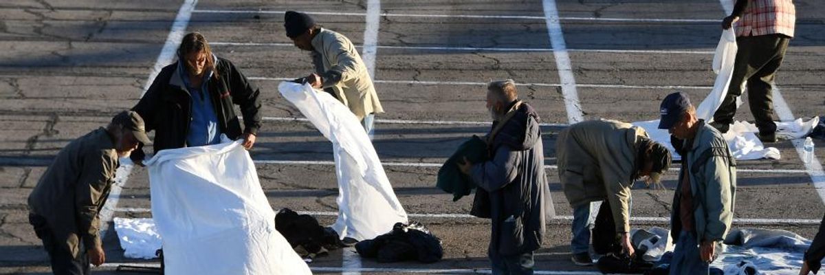 As Thousands of Las Vegas Hotel Rooms Sit Empty, City Paints 'Social Distancing Boxes' in Parking Lot for Homeless People