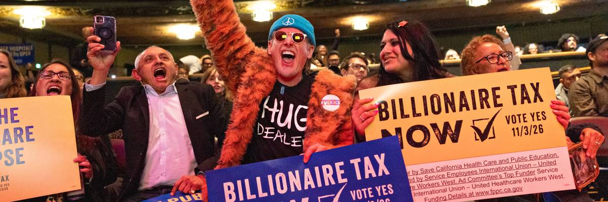 People attend a "Billionaire Tax Now" rally featuring remarks from US Sen. Bernie Sanders