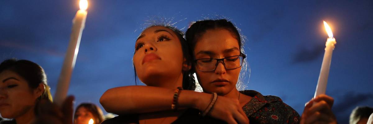 People attend a candlelight vigil at a makeshift memorial honoring victims of a mass shooting that left at least 22 people dead, on August 7, 2019 in El Paso, Texas. (Photo: Mario Tama/Getty Images)