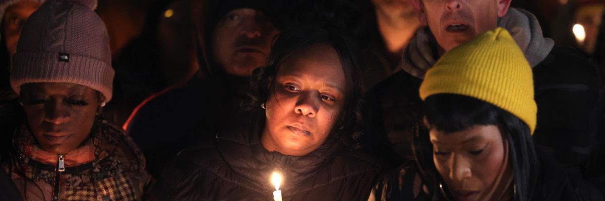 People attend a candlelight vigil in memory of Tyre Nichols