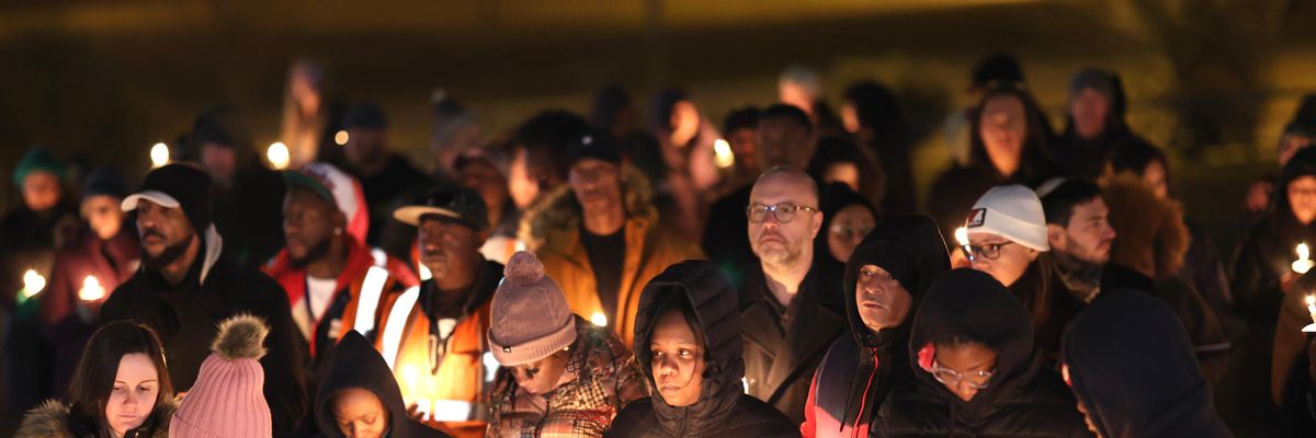 People attend a candlelight vigil in memory of Tyre Nichols