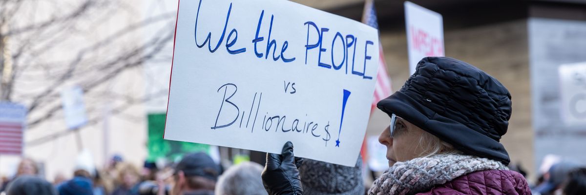 People attend a protest in support of the U.S. Consumer Financial Protection Bureau