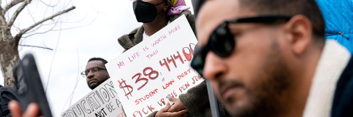 People attend a rally to urge the Biden administration to cancel all federal student loan debt in Washington, D.C. on April 4, 2022.