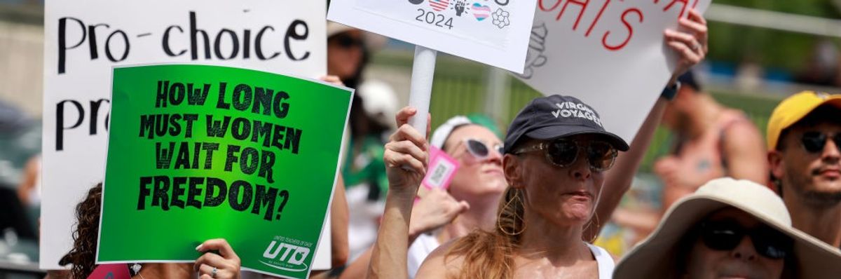 People attend the Our Bodies Our Lives: A Rally for Reproductive Freedom