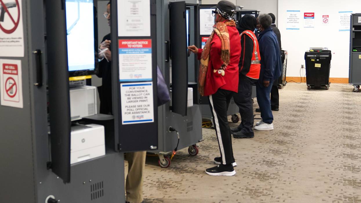 People cast their votes on the first day of early voting in Georgia