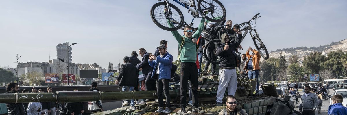 People celebrate Assad's fall in Syria.