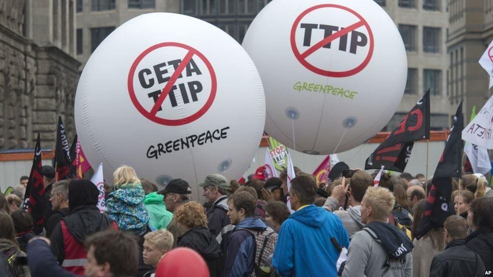 People demonstrate against the TTIP and CETA trade agreements in Leipzig, Germany, Sept. 17, 2016. Thousands of people are rallying in cities across Germany to protest against planned European Union trade deals with the United States and Canada. (Photo: AP)
