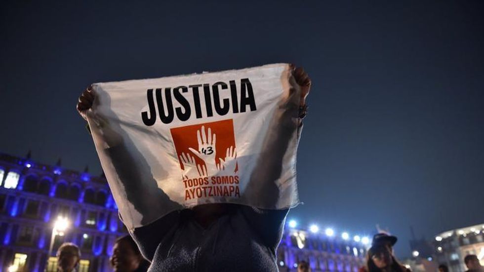 People demonstrate in Mexico City on Nov. 20 against the presumed massacre of 43 students in Guerrero state. (Photo: Yuri Cortez / AFP/Getty Images)