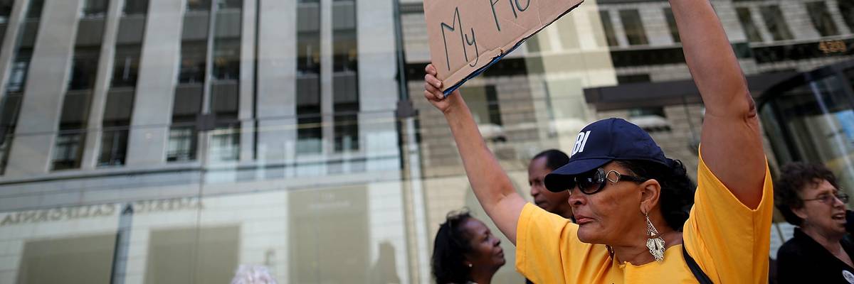 People demonstrate outside Wells Fargo headquarters in San Francisco on April 23, 2013.