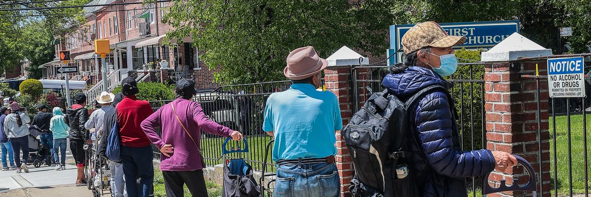 People facing food insecurity wait in line to get meal