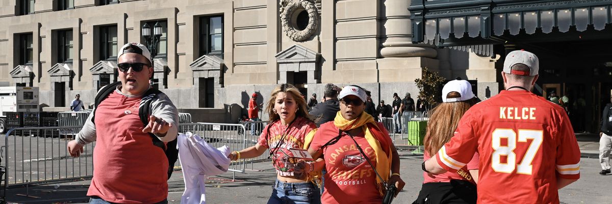People flee after shots were fired near the Kansas City Chiefs' Super Bowl LVIII victory parade