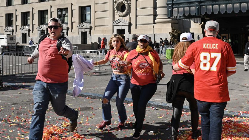 People flee after shots were fired near the Kansas City Chiefs' Super Bowl LVIII victory parade
