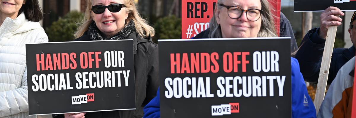People gather at a rally supporting Social Security.