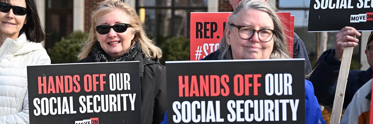 People gather at a rally supporting Social Security.