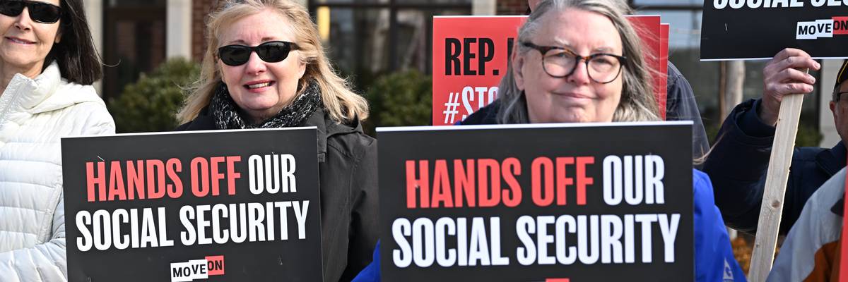People gather at a rally supporting Social Security.