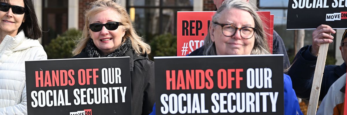 People gather at a rally supporting Social Security.