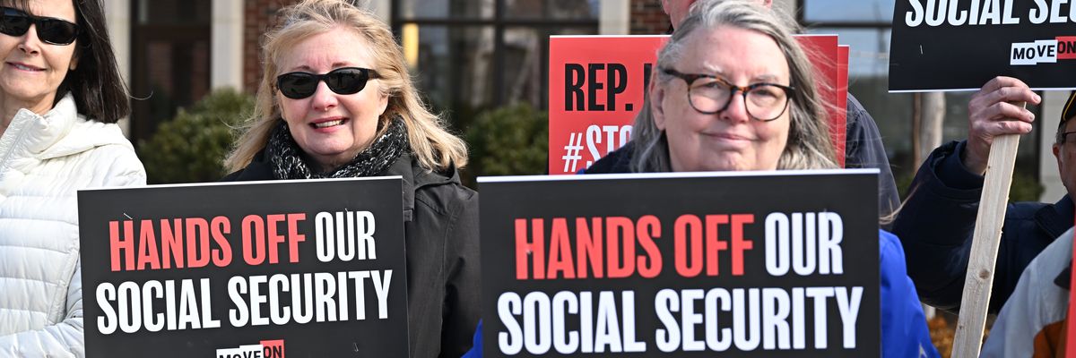 People gather at a rally supporting Social Security. 