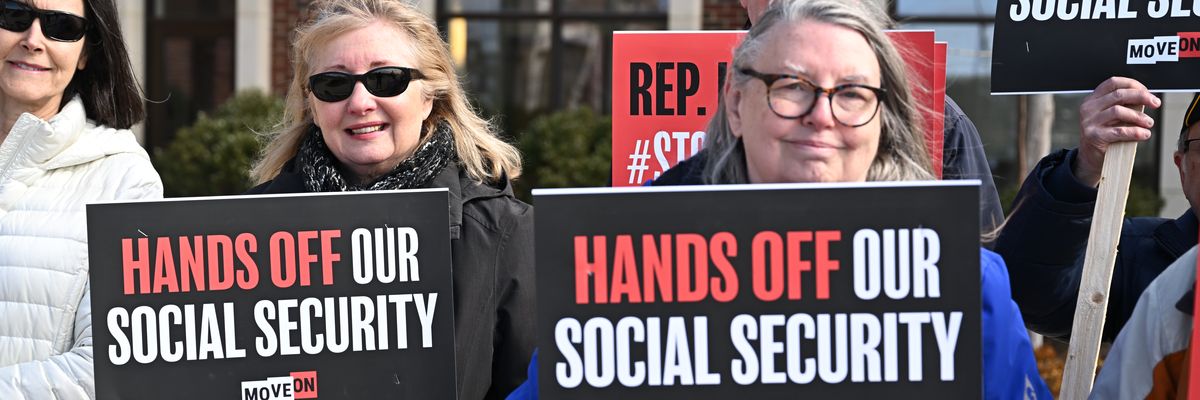 People gather at a rally supporting Social Security. 