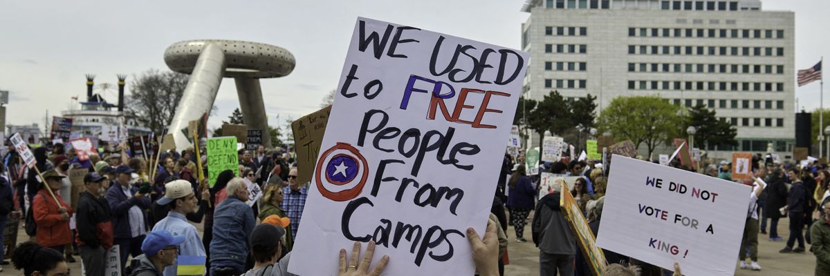 People gather at Hart Plaza in downtown Detroit, Michigan on April 19, 2025, to protest the Trump administration