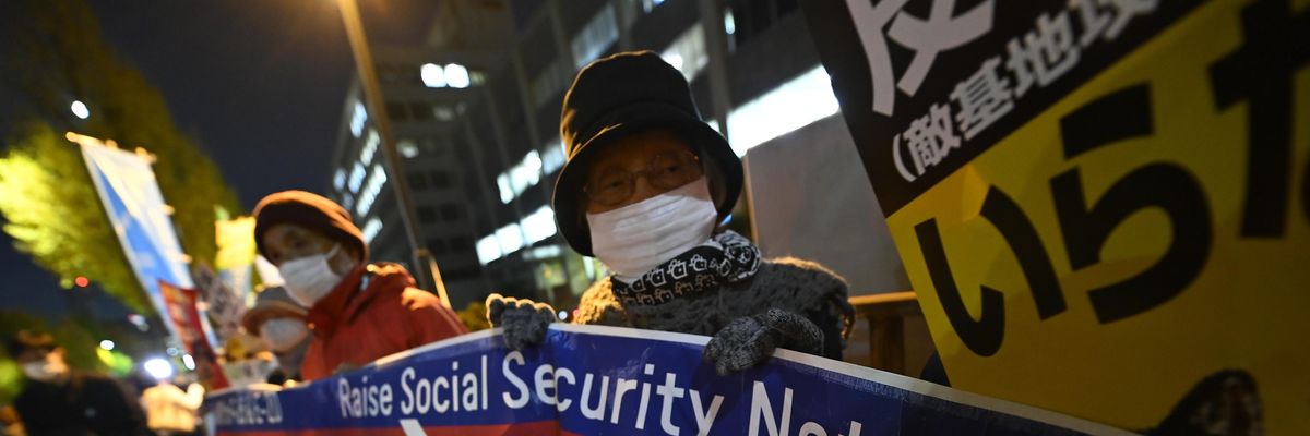 People gather in front of Japanese Prime Minister Fumio Kishida's office in Tokyo on December 9, 2022 to protest the government's plan to double military spending.