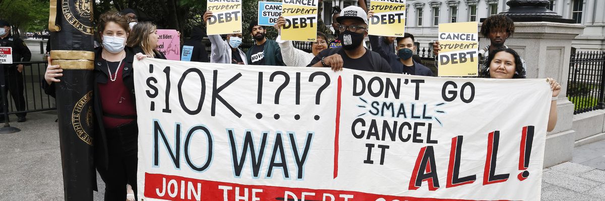 People gather near the White House to tell President Joe Biden to cancel student loan debt on May 12, 2020 in Washington, D.C.