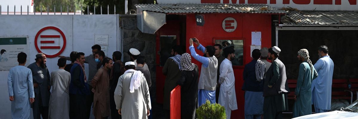 People gather to check on missing relatives a day after a deadly attack outside Kabul's international airport, at a hospital run by Italian NGO Emergency, in Kabul, Afghanistan on August 27, 2021. (Photo: Aamir Qureshi/AFP via Getty Images)