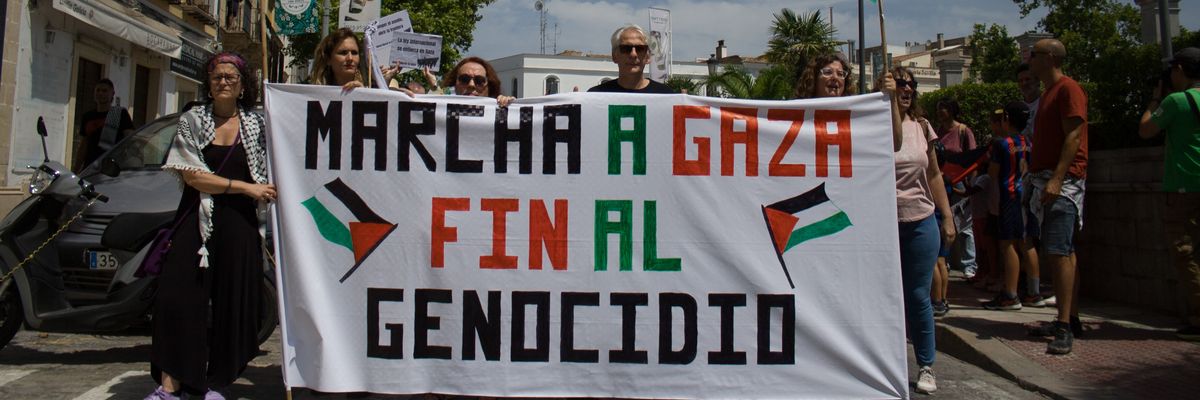 People hold a banner reading, "Martha a Gaza. Fin al genocidio."