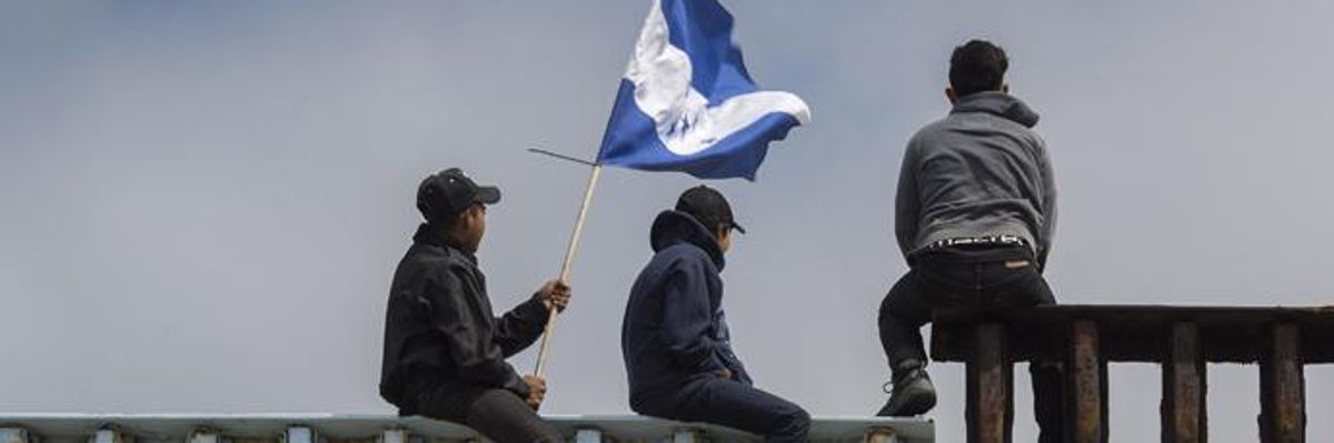 Caravan of Central American Asylum Seekers Greeted by Supporters at Border