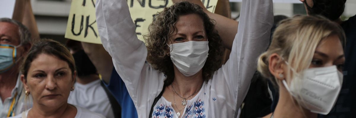 People hold banners during a demonstration in support of Ukraine at Paulista avenue in Sao Paulo, Brazil on March 1, 2022.