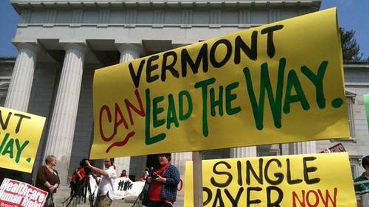 People holding posters in front of a government building