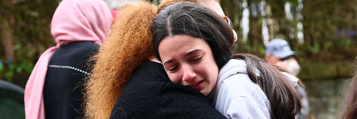 People hug after the Manchester synagogue attack