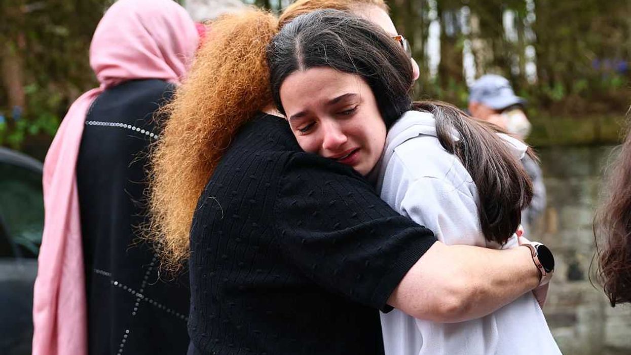 People hug after the Manchester synagogue attack