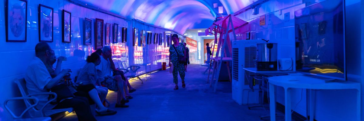 People in China shelter from heat in a bomb shelter.