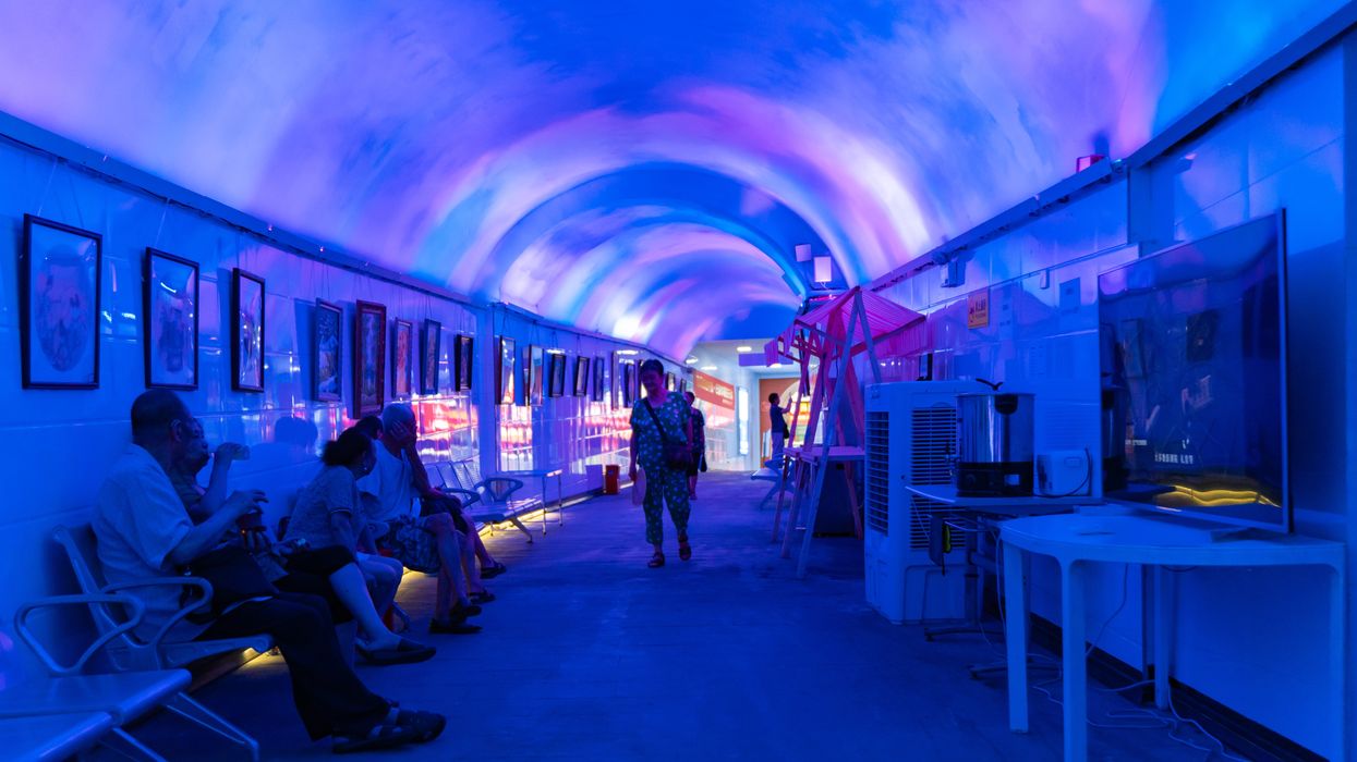 People in China shelter from heat in a bomb shelter.