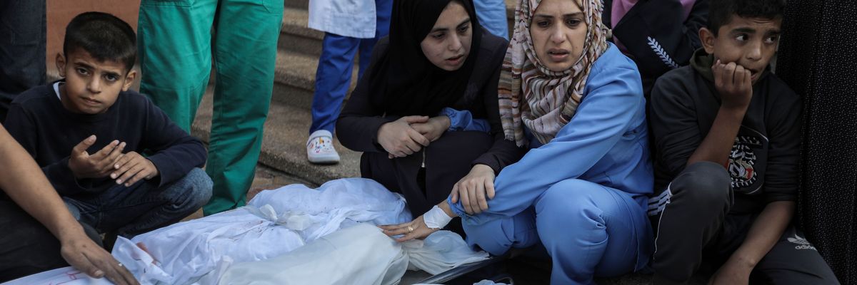 people in gaza mourn those killed