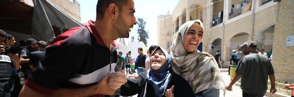 People in Gaza mourning the loss of their loved ones after Israeli attack