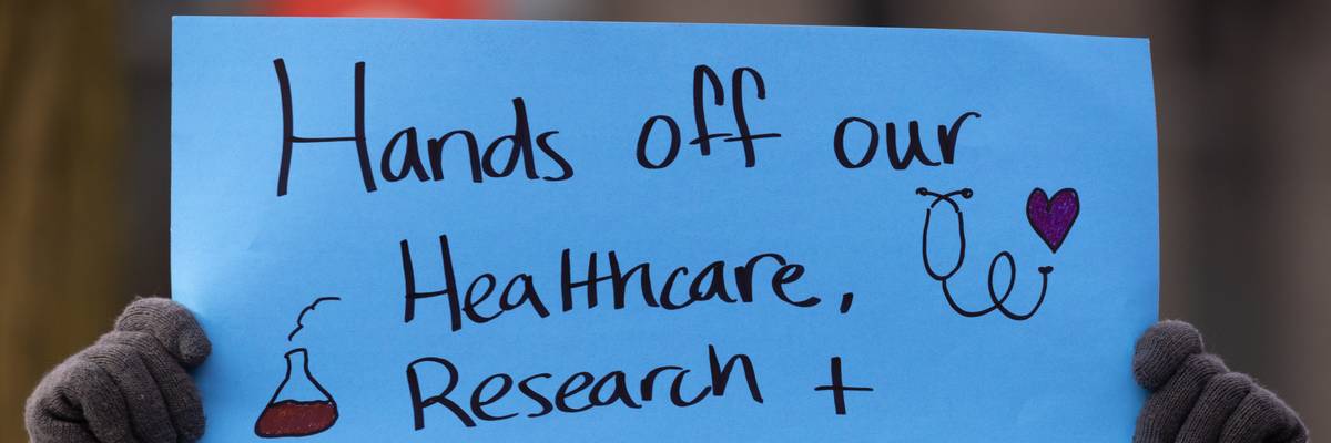 People including researchers from Chicago area universities gather to voice concerns about the potential loss of federal funding for medical research