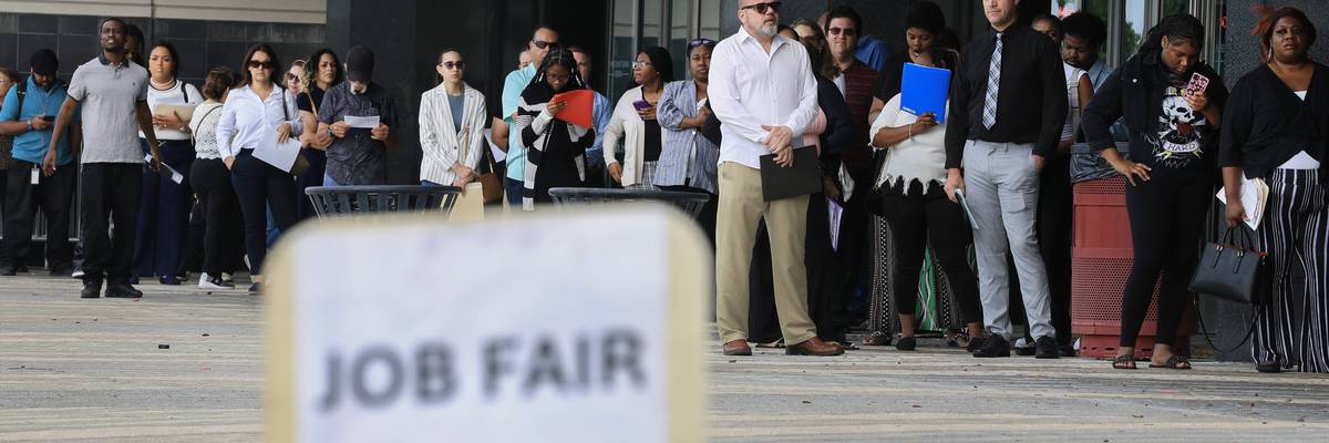 People line up at a job fair