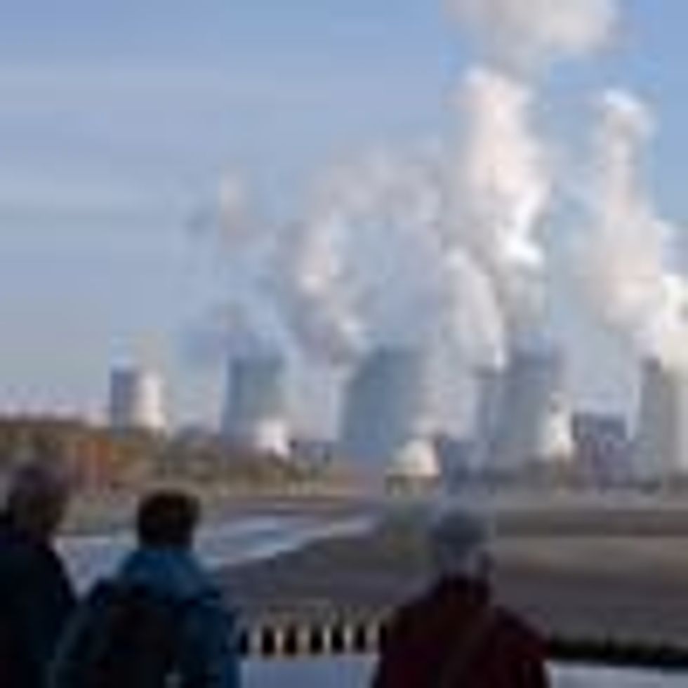 People look at the Jaenschwalde lignite coal-fired power plant