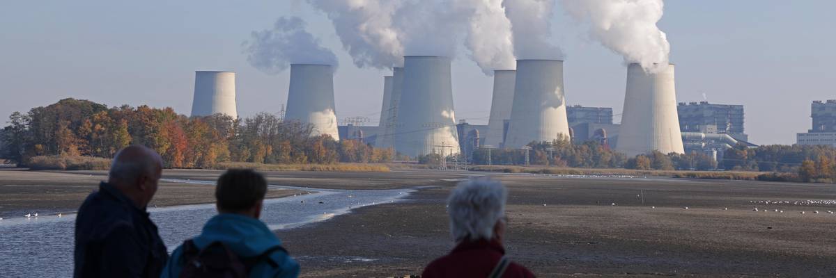 People look at the Jaenschwalde lignite coal-fired power plant.