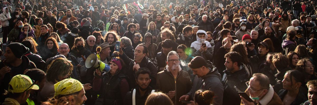 People march in Paris on April 13, 2023 to protest French President Emmanuel Macron's attack on the country's pension system.