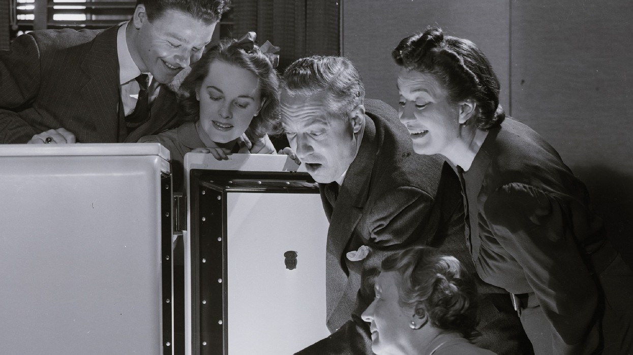 People marvel at a refrigerator