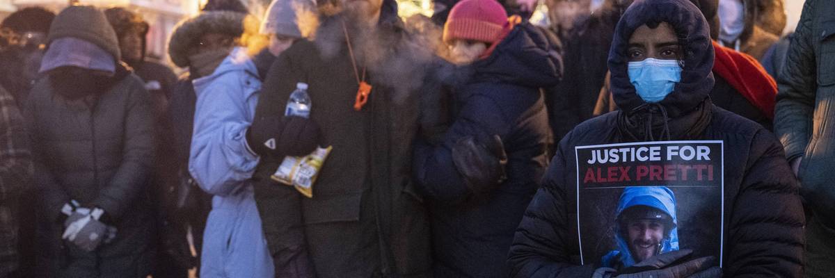People mourn at a makeshift memorial