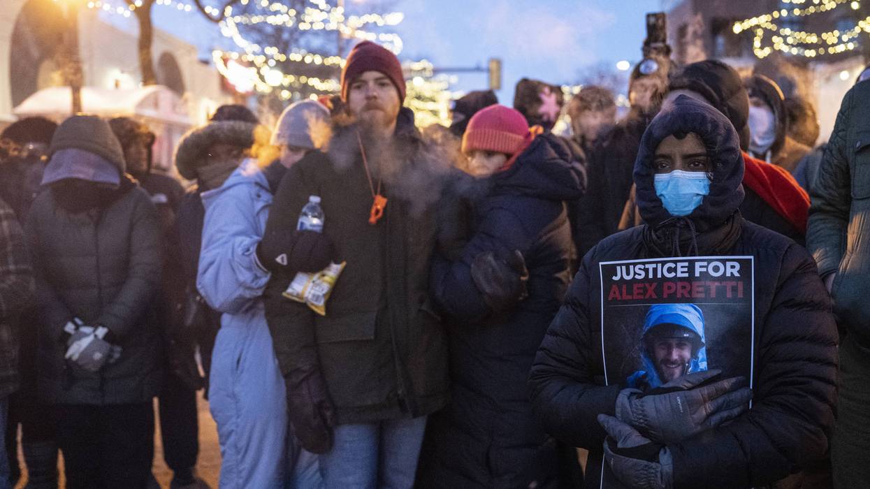 People mourn at a makeshift memorial