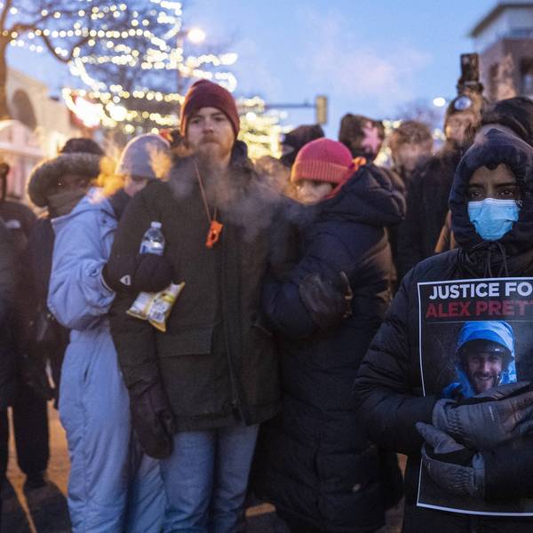 People mourn at a makeshift memorial